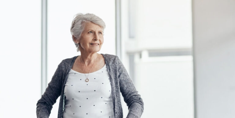 Senior Woman with Mobility Support Walking Safely at Independent Living Facility