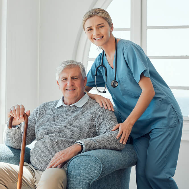 Caregiver Comforting Resident at Memory Care Facility